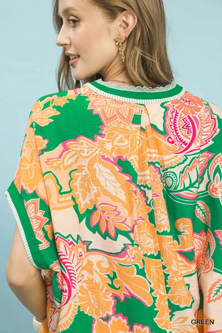 Oversized floral print top with V-neck and lace trim