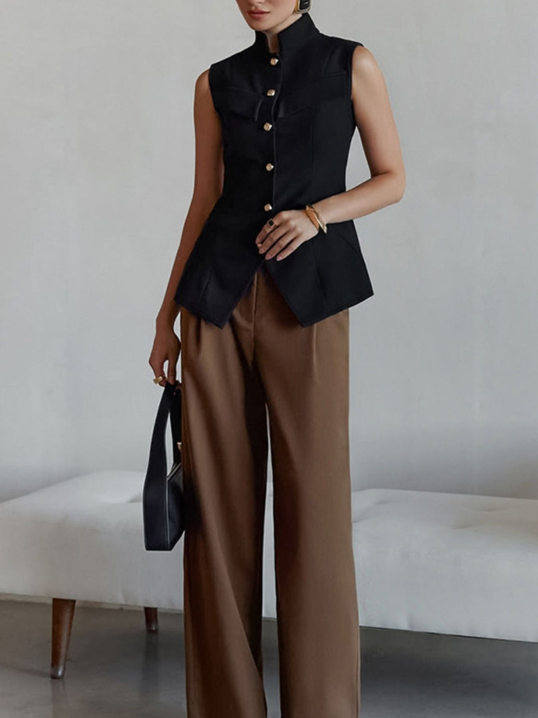 Stand collar sleeveless button-front vest with split hem