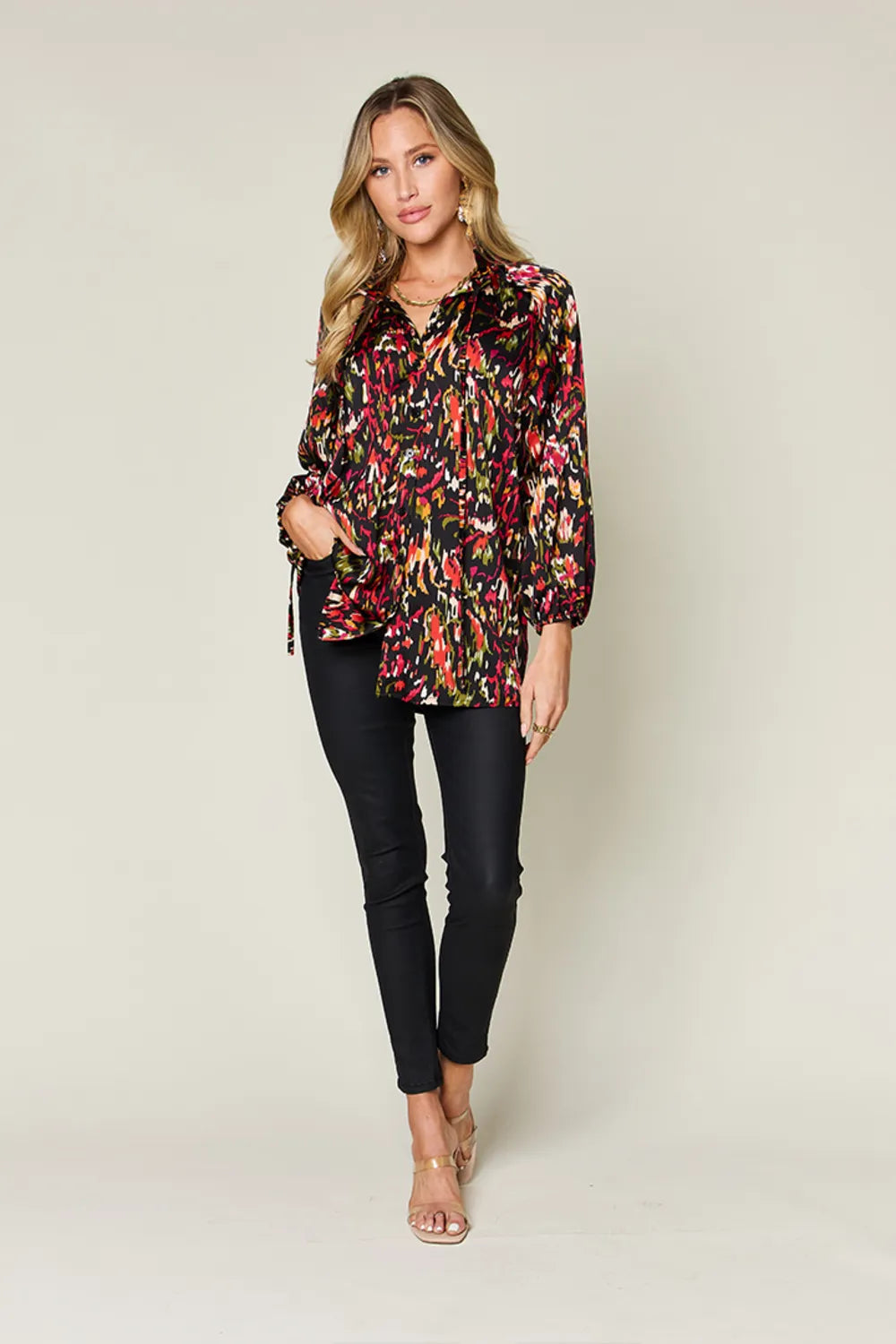 Abstract print button-up shirt with tie neck and long sleeves