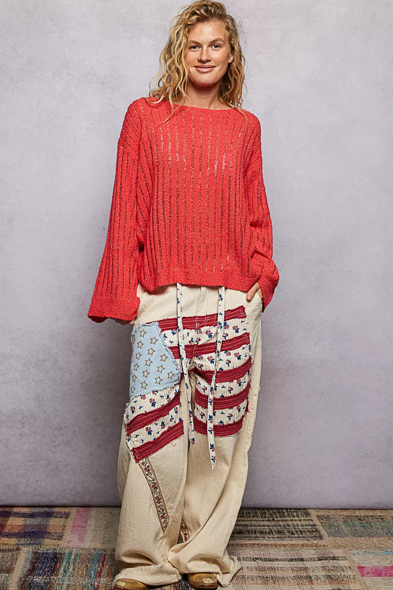 Open-weave knit sweater with relaxed drop-shoulder fit