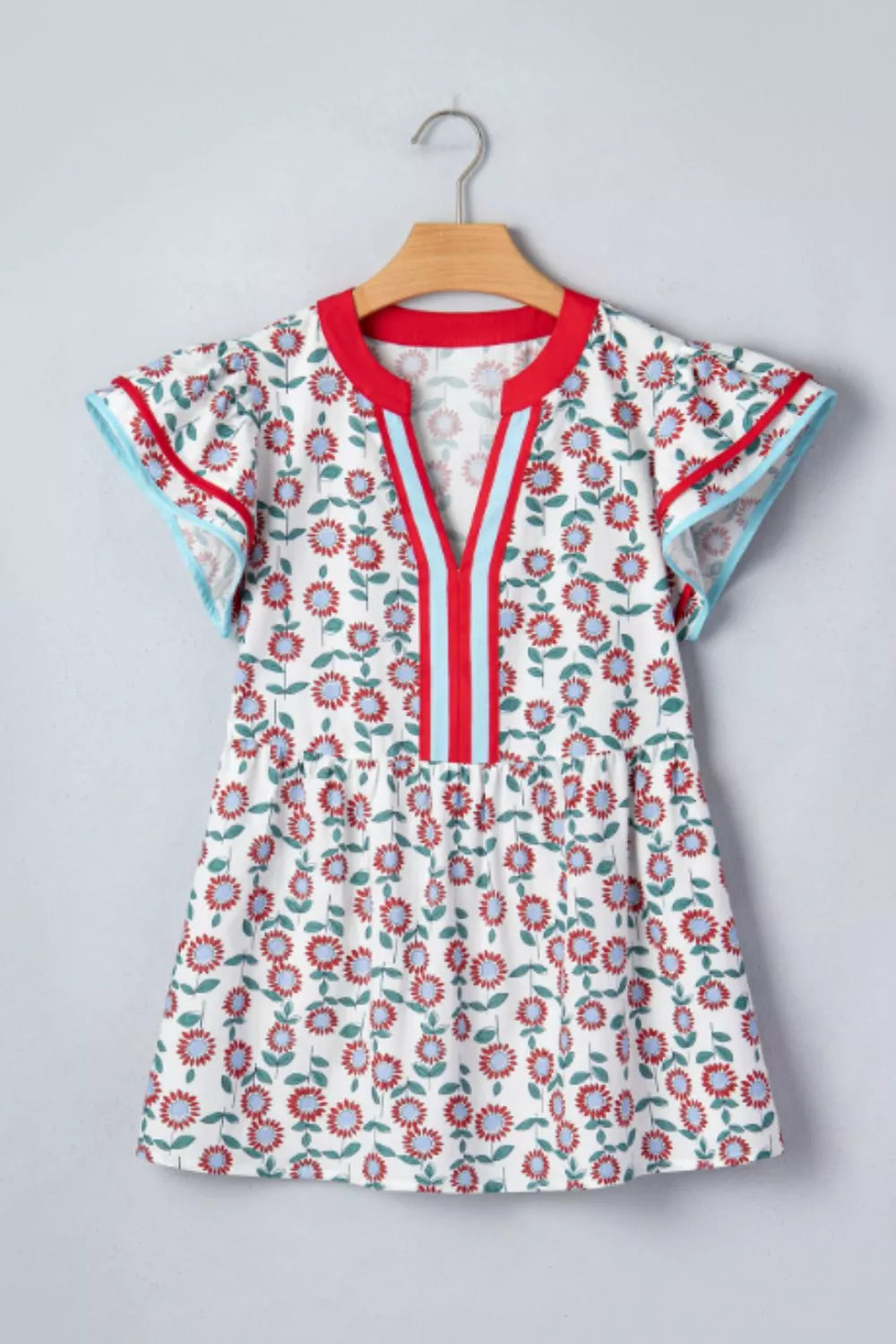 Floral babydoll blouse with ruffle cap sleeves and striped V-neck