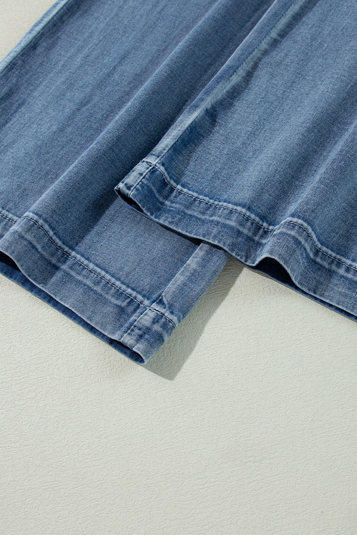 Pleated high-rise wide-leg jeans with deep pockets