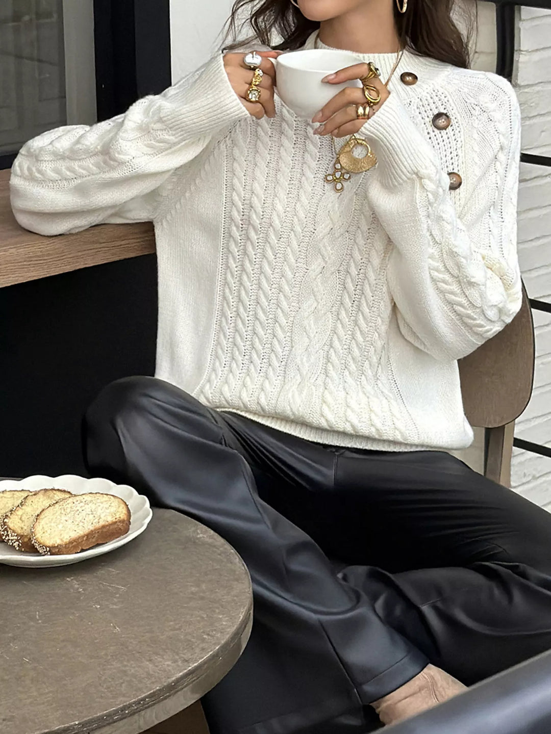 Cable-knit mock neck sweater with shoulder buttons