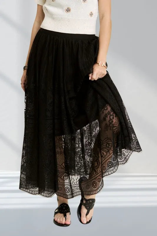 Tiered lace maxi skirt with elastic waist and raw hem