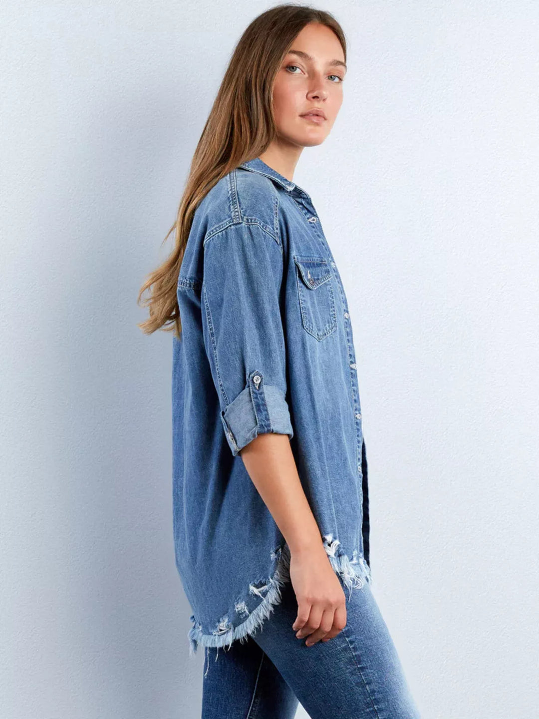 Oversized denim shirt with heart pocket and frayed hem