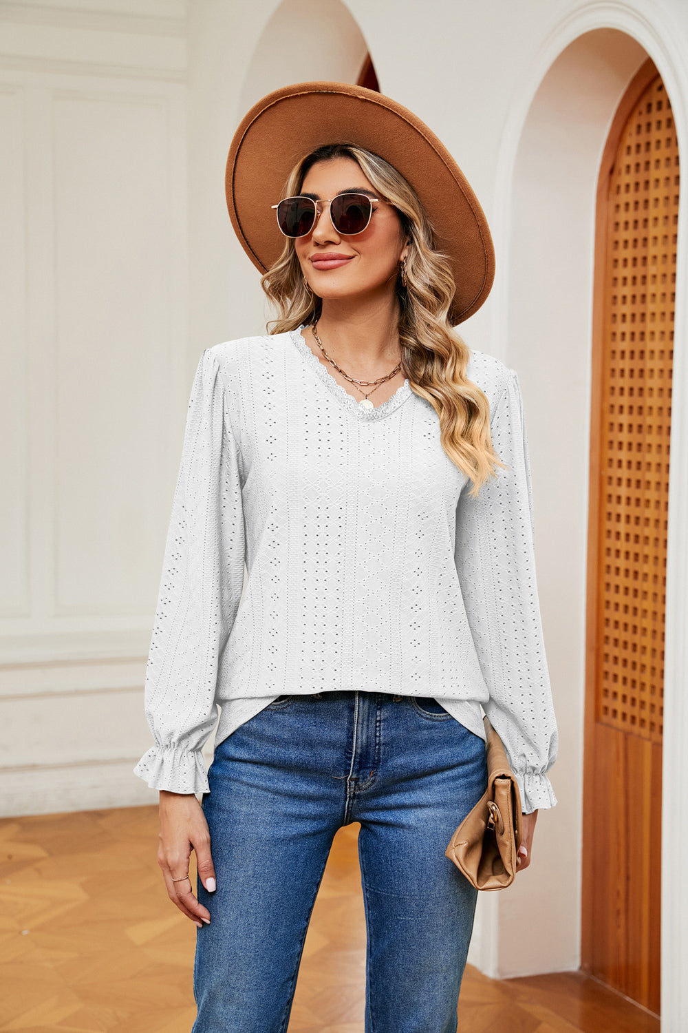 Eyelet V-neck blouse with flounce sleeves and lace trim