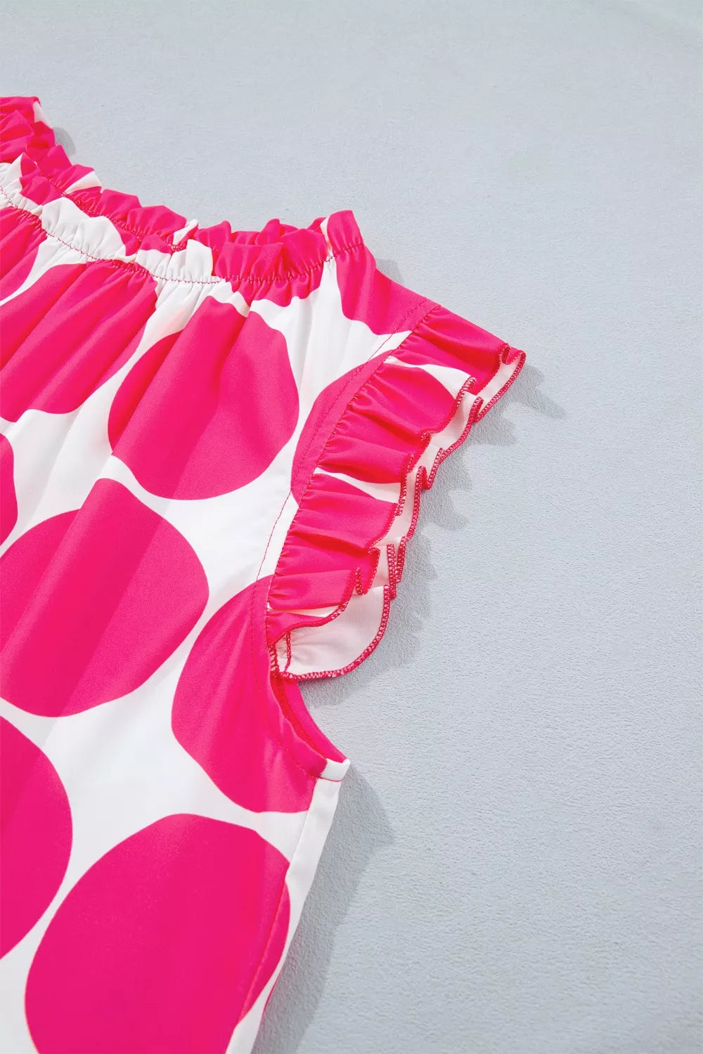 Large polka dot ruffle-neck sleeveless shift top