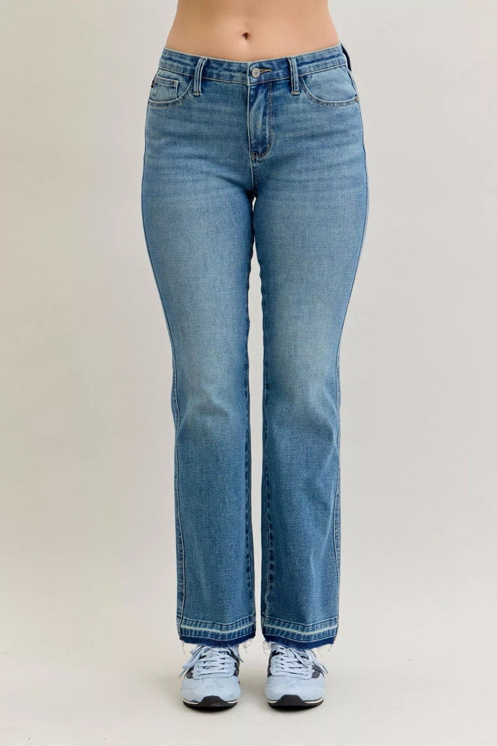 Mid-rise slim bootcut jeans with release hem and tummy control