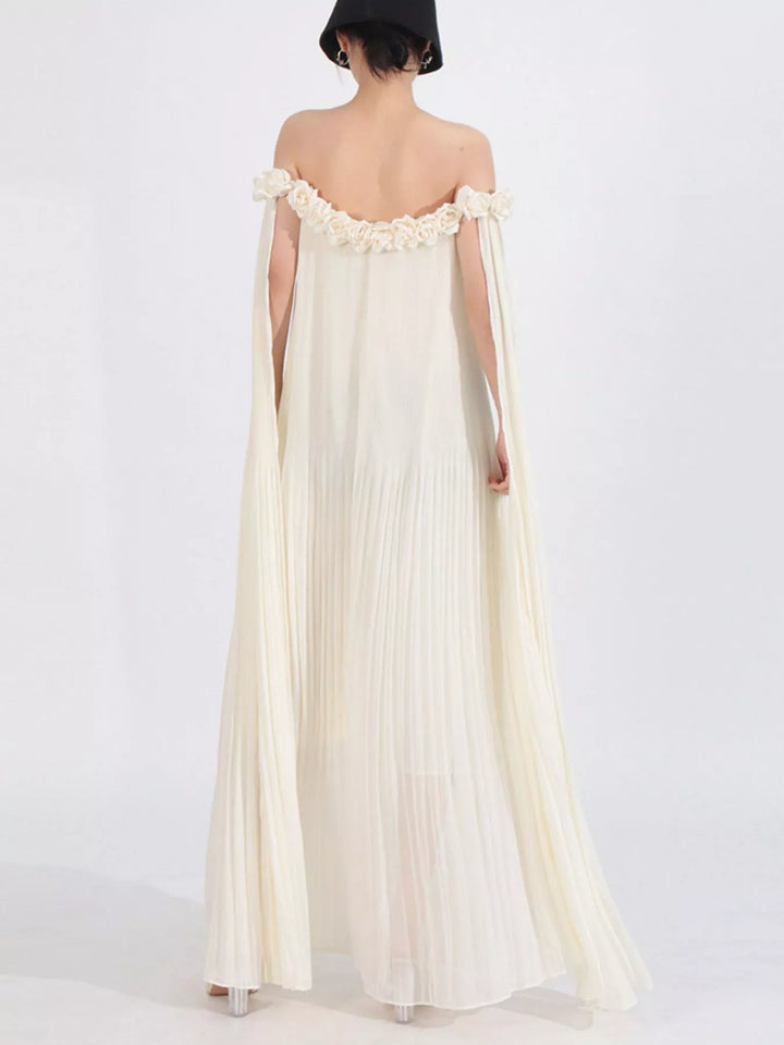 Off-shoulder pleated maxi dress with rosette neckline