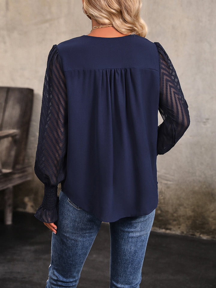 Sheer chevron mesh sleeve V-neck blouse with smocked cuffs