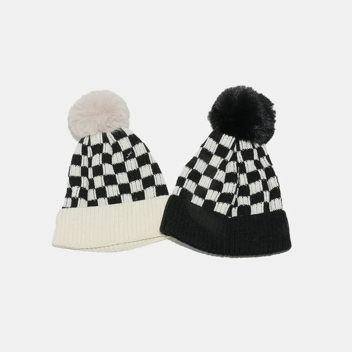 Checkerboard knit beanie with faux fur pompom