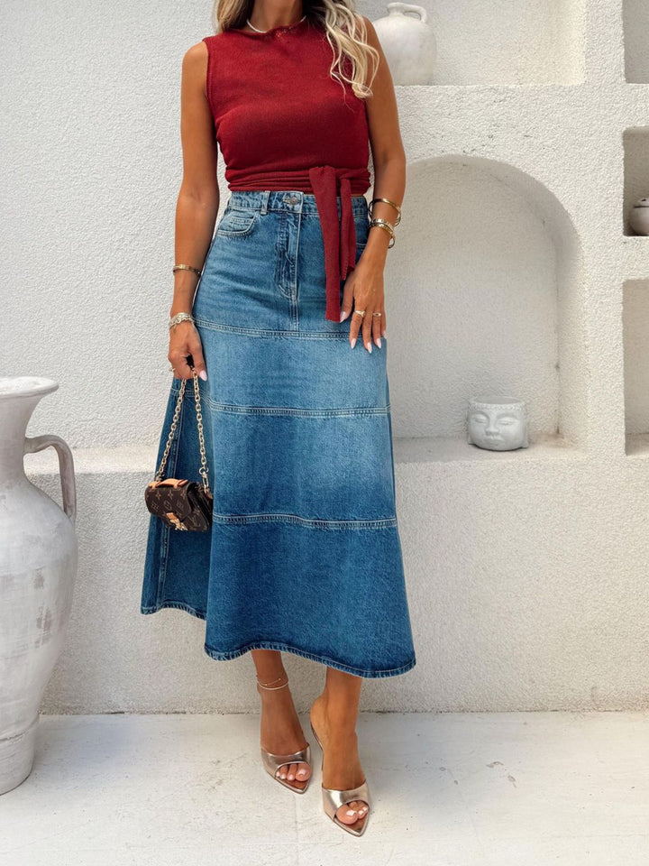 High-rise A-line denim midi skirt with panel seams