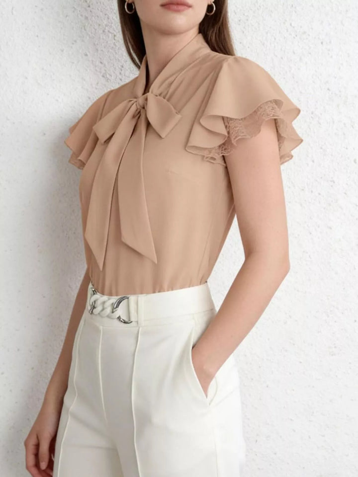 Tie-neck ruffle cap sleeve blouse with lace trim