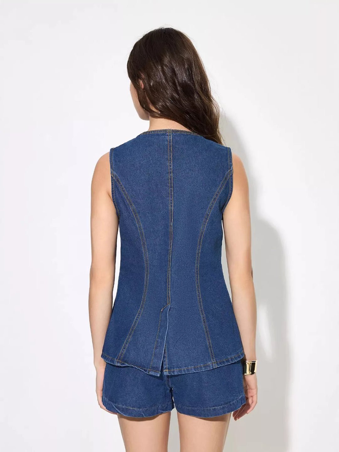 Sleeveless button-up denim top with welt pockets