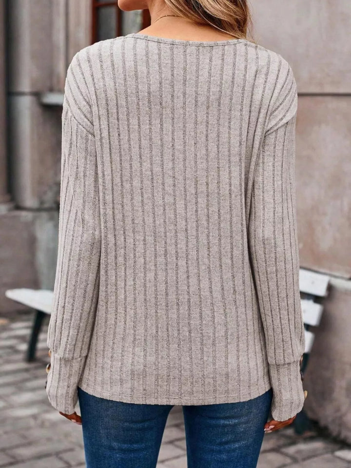 Ribbed knit V-neck top with buttoned cuffs