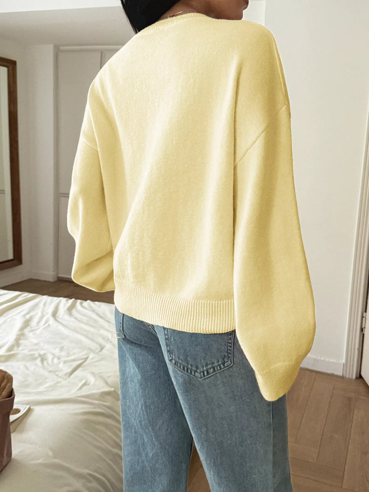 V-neck loose knit sweater with ribbed trim