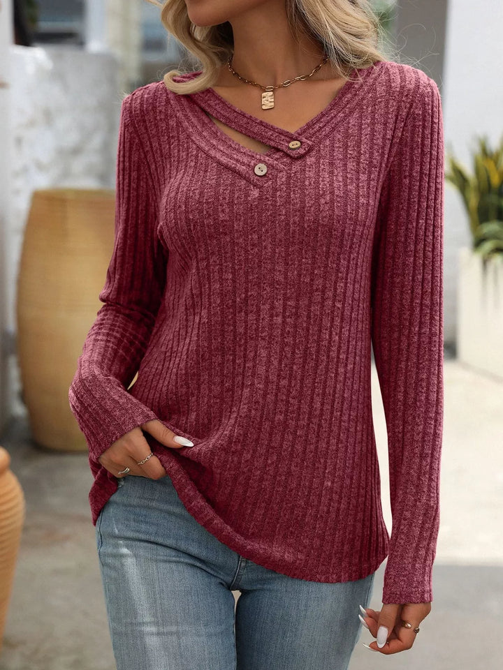 Ribbed knit long sleeve top with asymmetric button neckline