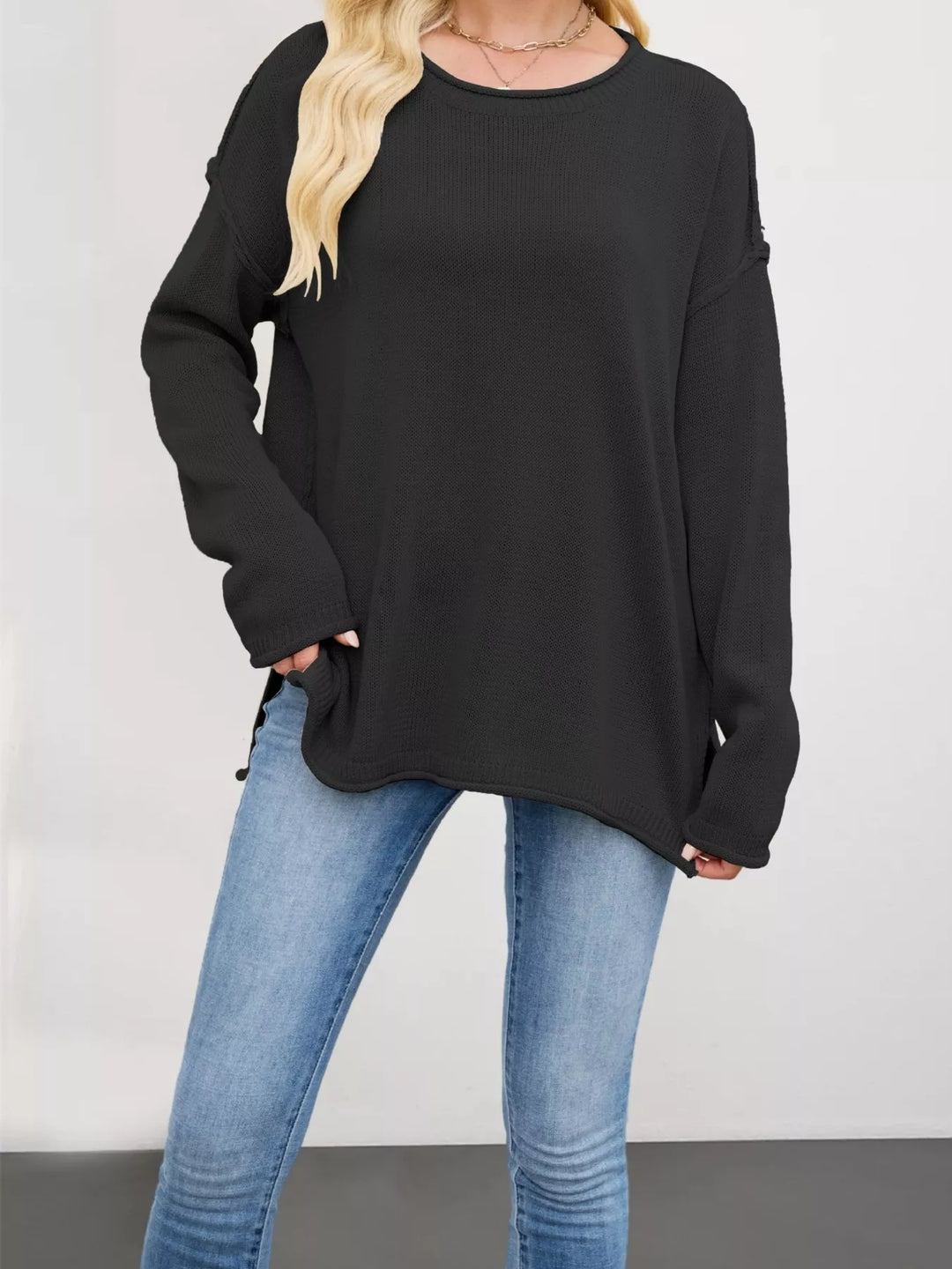 Exposed seam oversized crew neck sweater with raw hem
