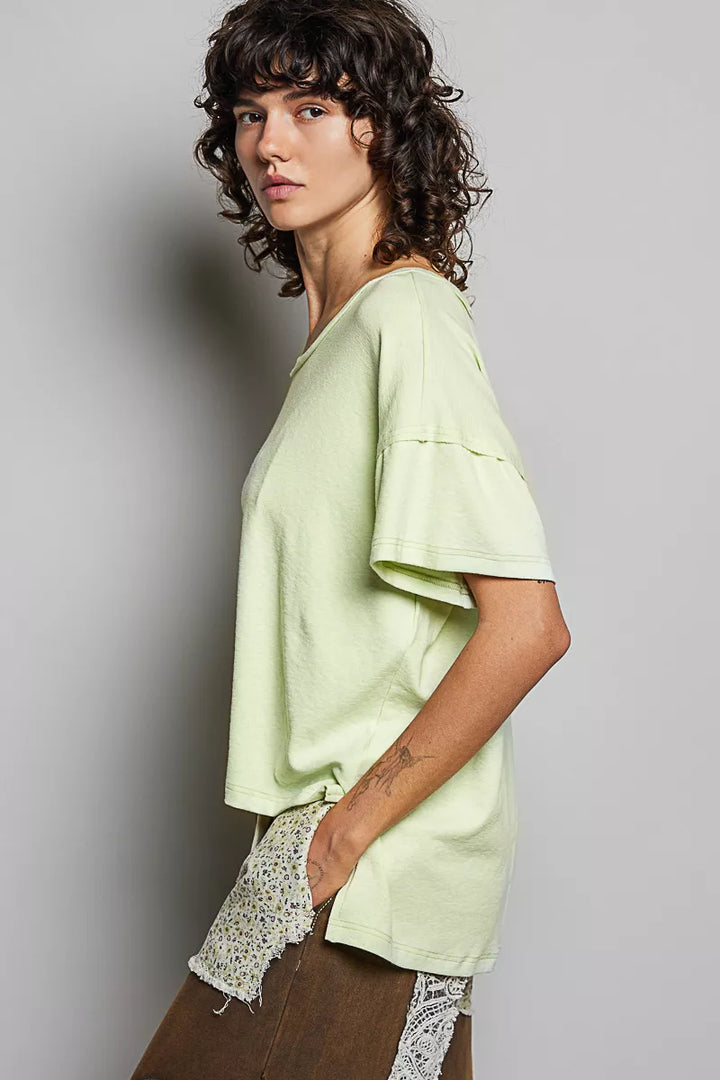 Relaxed short sleeve tee with high-low hem and exposed seams