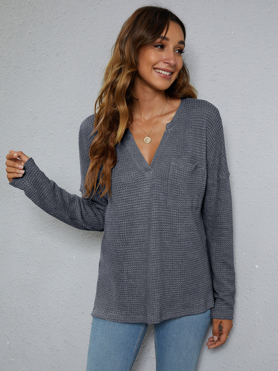 Dropped-shoulder waffle-knit V-neck top with high-low hem