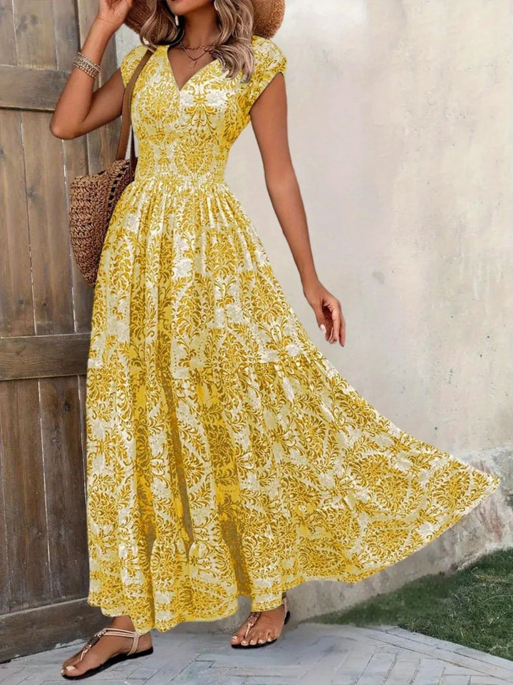 Smocked tiered maxi dress with cap sleeves and side slit