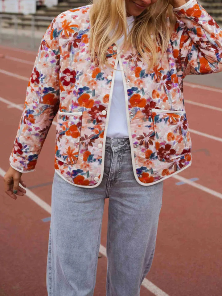 Floral print quilted jacket with contrast piping and patch pockets