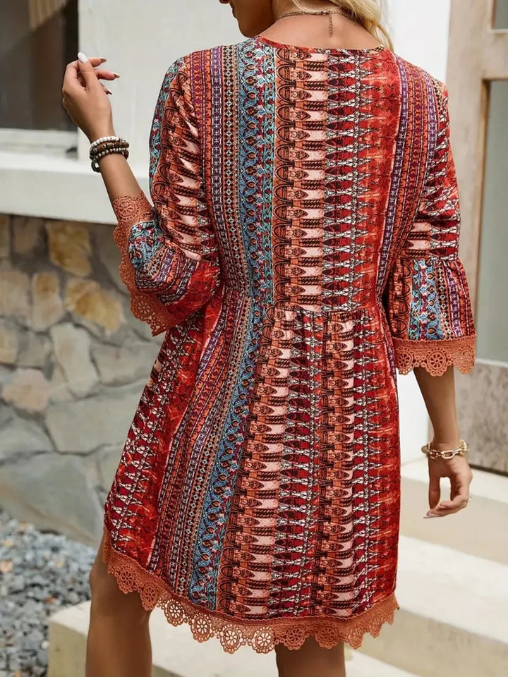 Boho printed mini dress with lace trim and bell sleeves