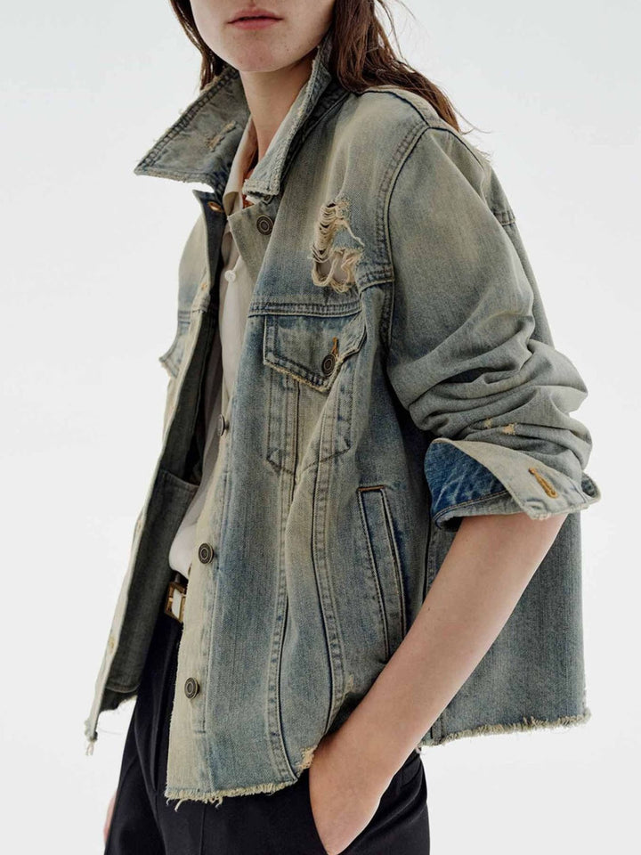 Distressed vintage wash denim jacket with raw hem