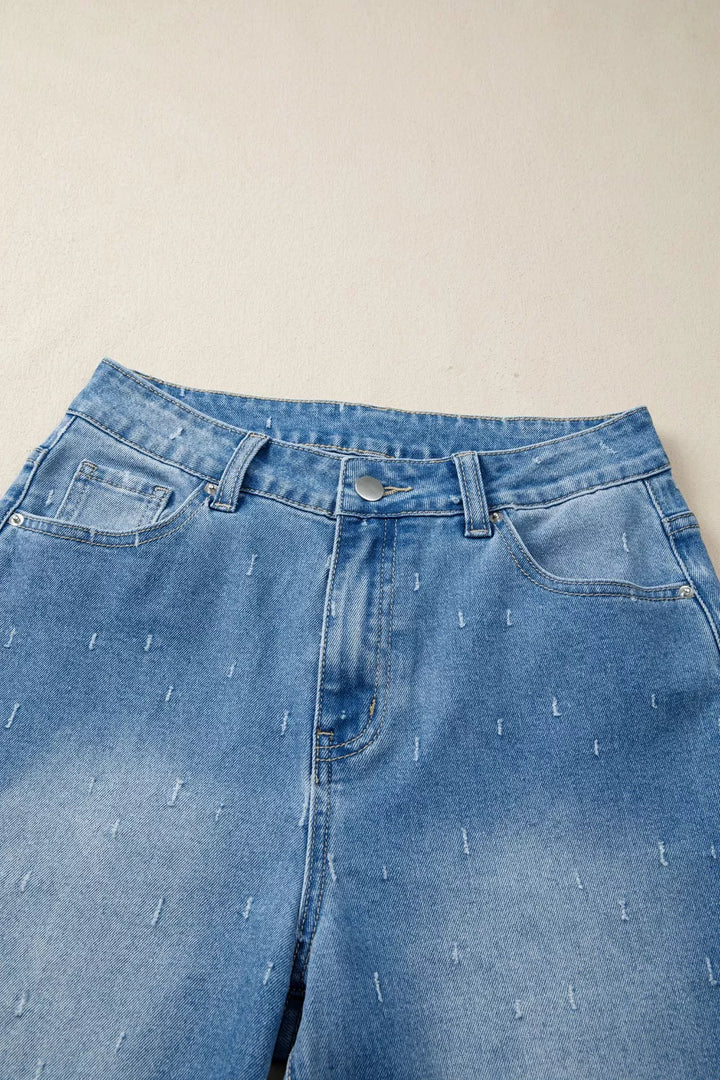 Distressed wide-leg jeans with tummy control and raw hem