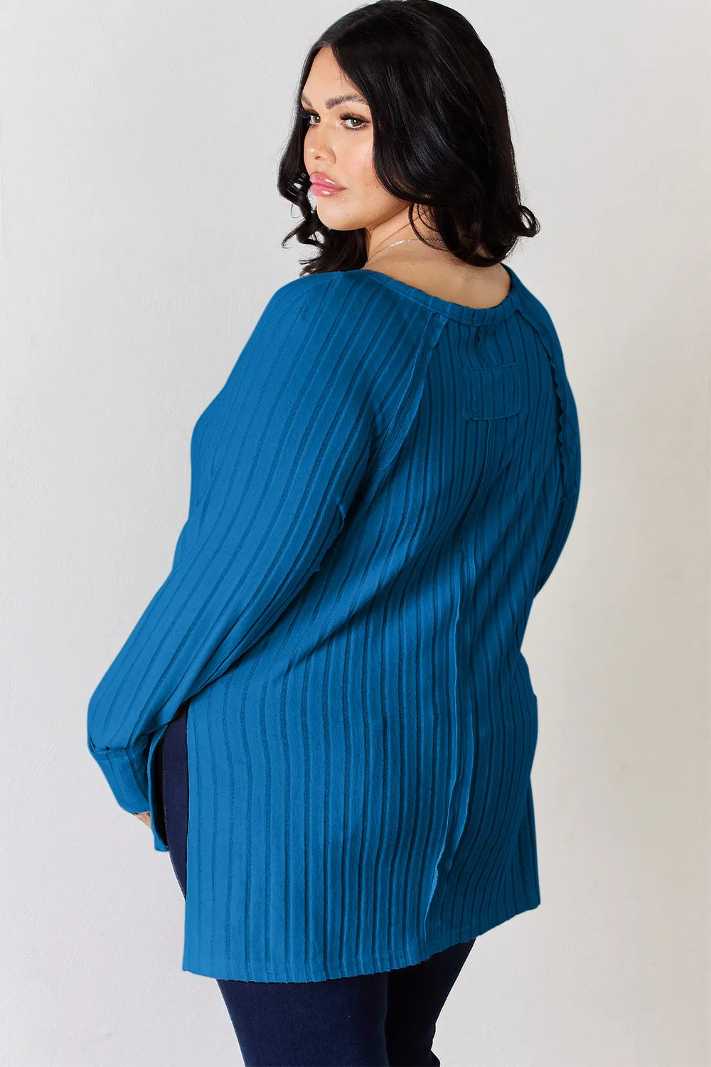 Ribbed knit round neck long sleeve top with side slits