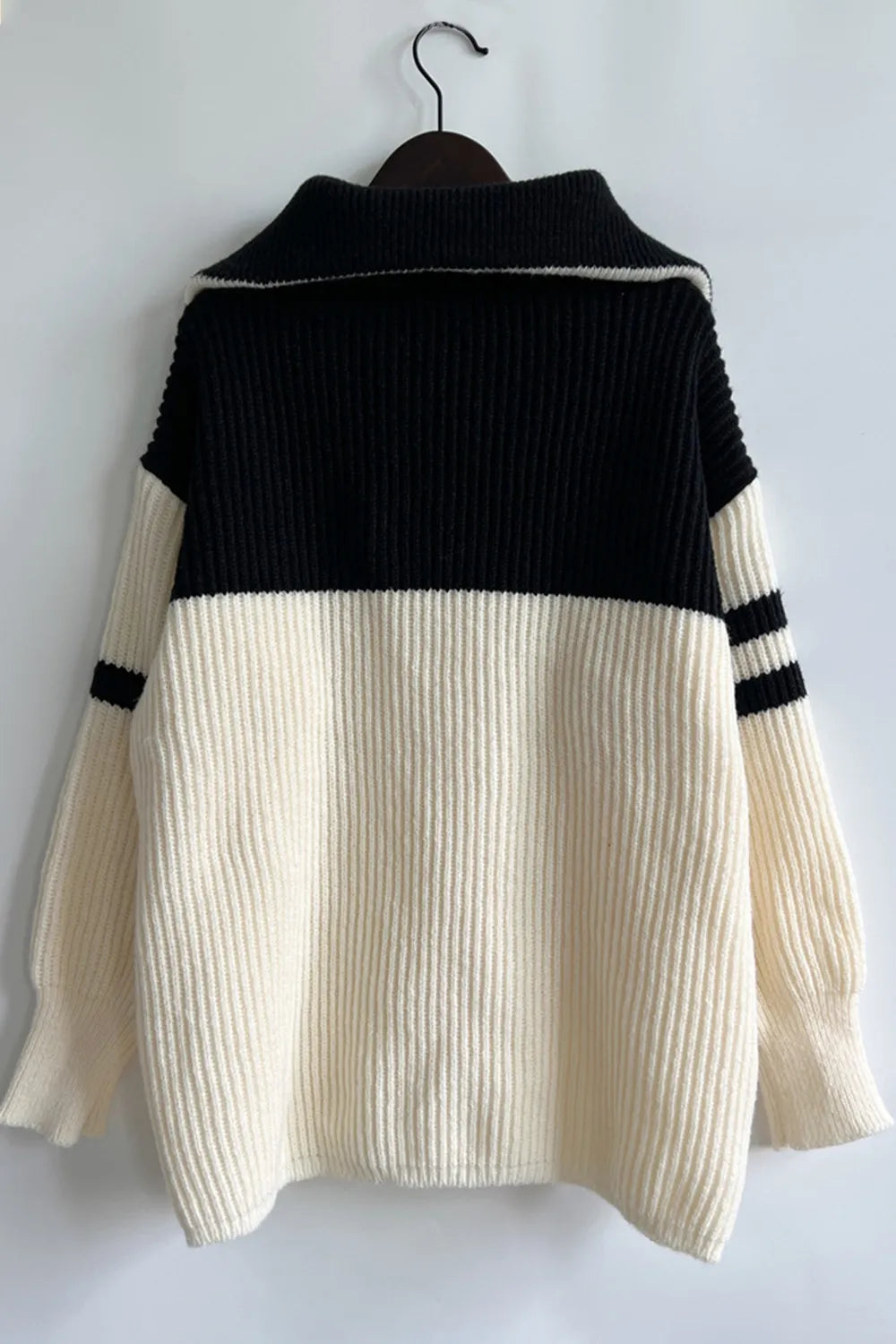 Quarter-zip ribbed knit sweater with striped sleeves