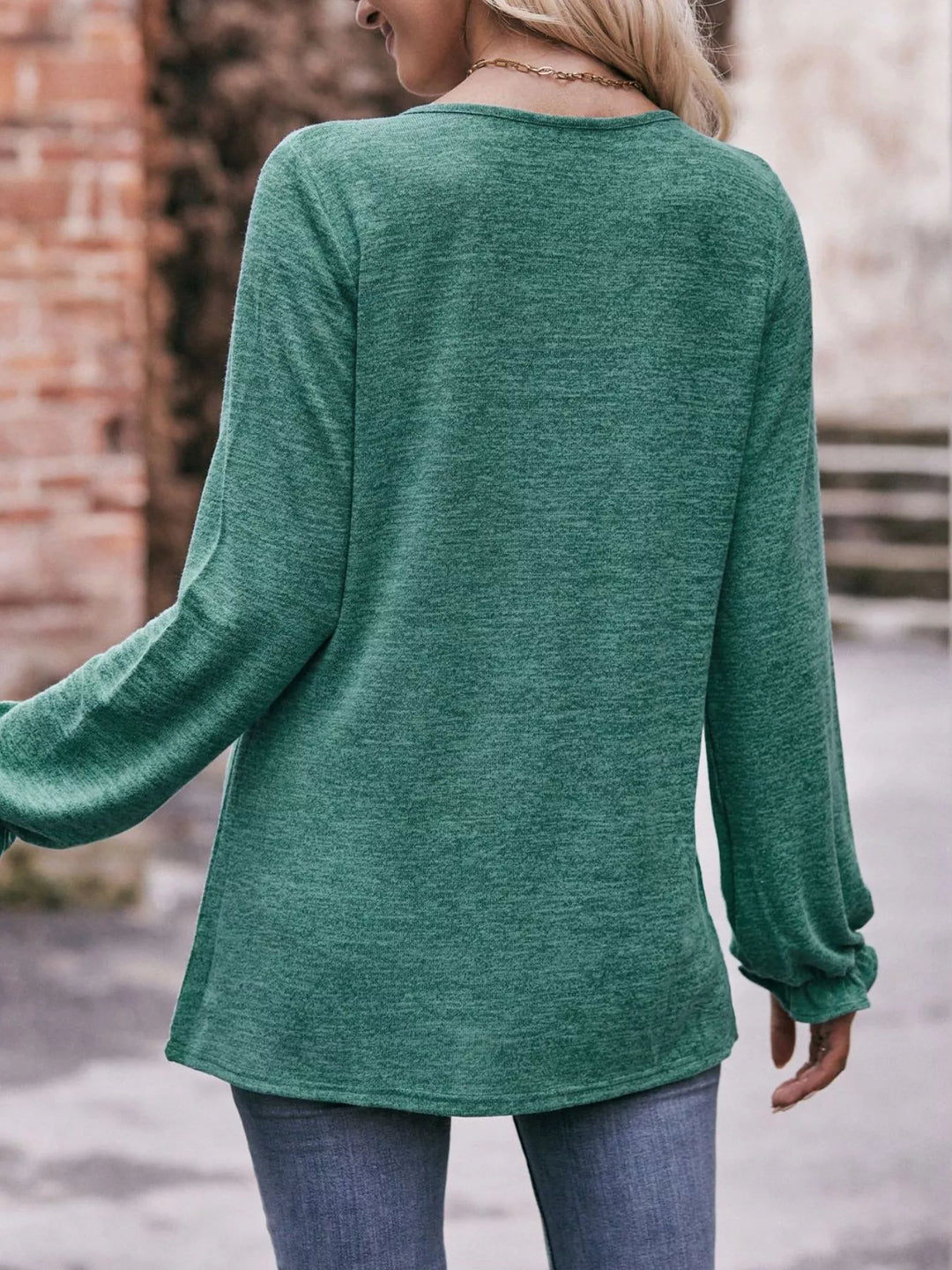 Ruffle cuff long sleeve top with pleated neckline