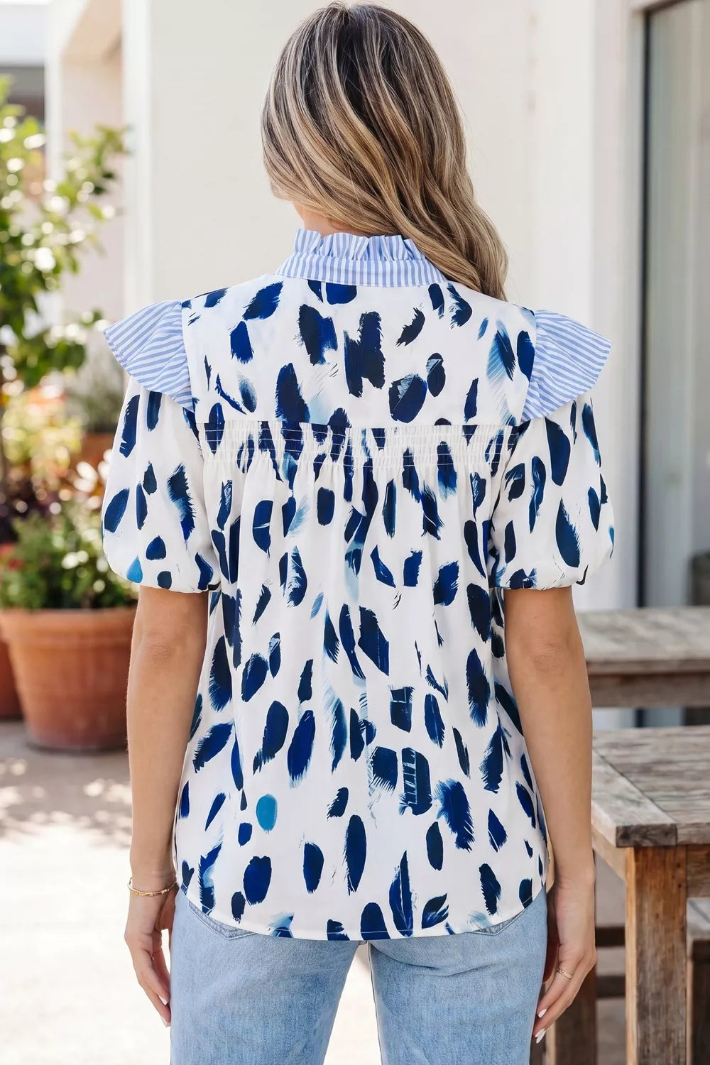 Abstract animal print blouse with striped ruffle yoke