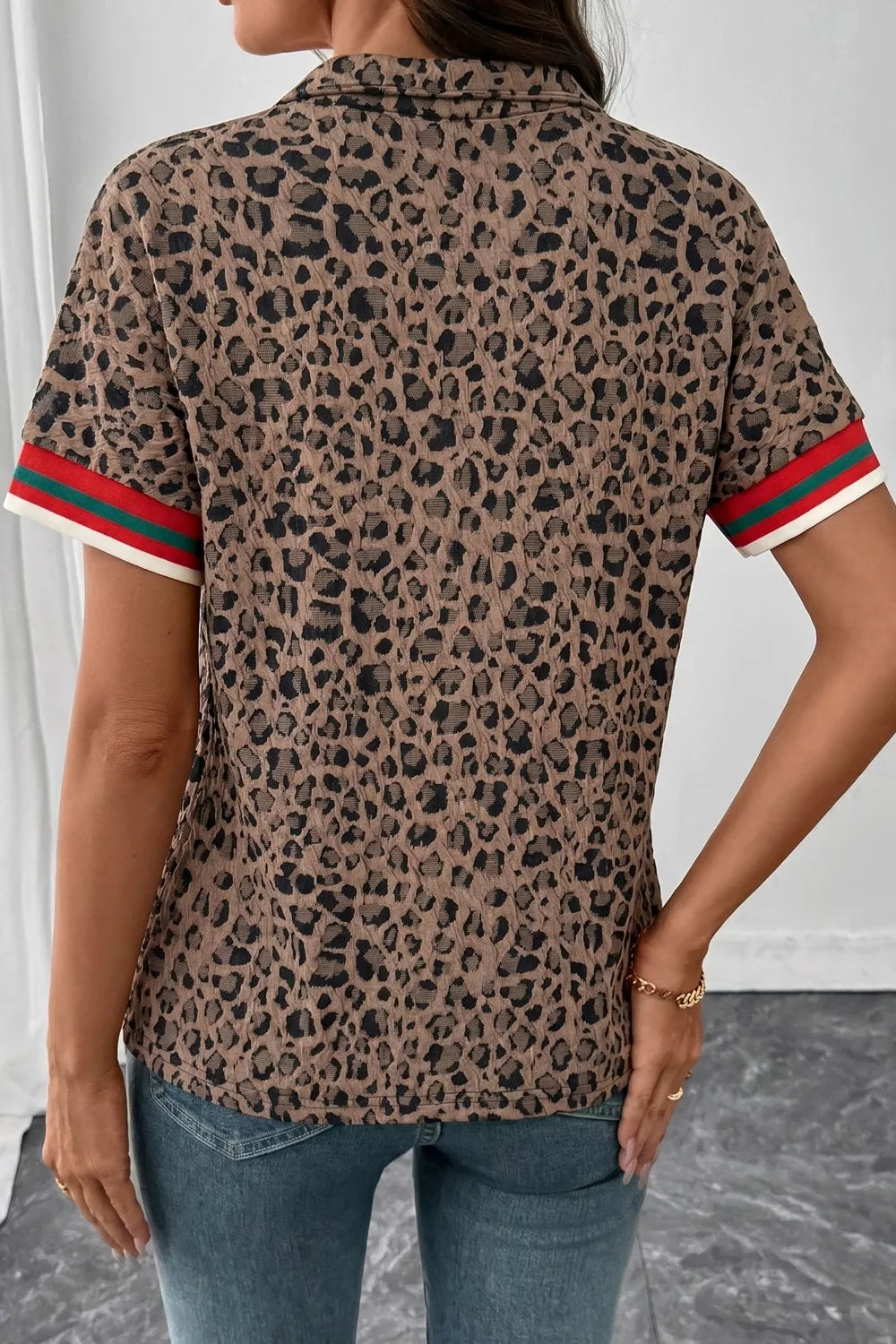 Leopard half-zip short sleeve top with striped collar and cuffs