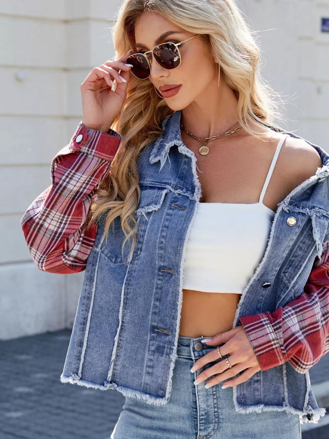 Raw hem denim jacket with plaid contrast sleeves
