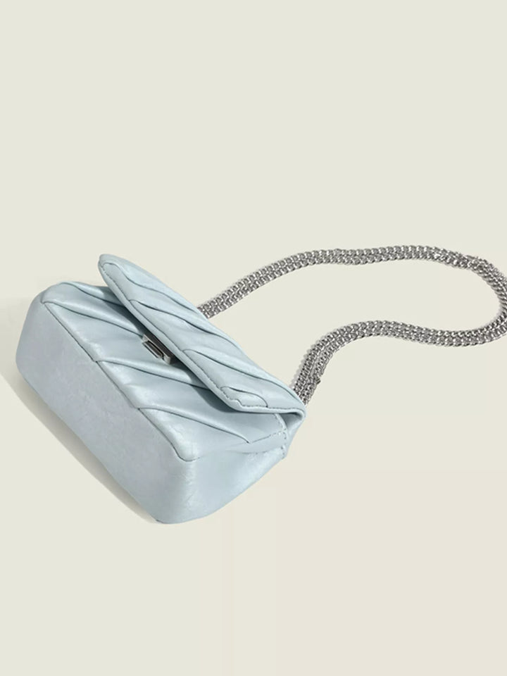 Ruched mini flap crossbody bag with silver chain strap