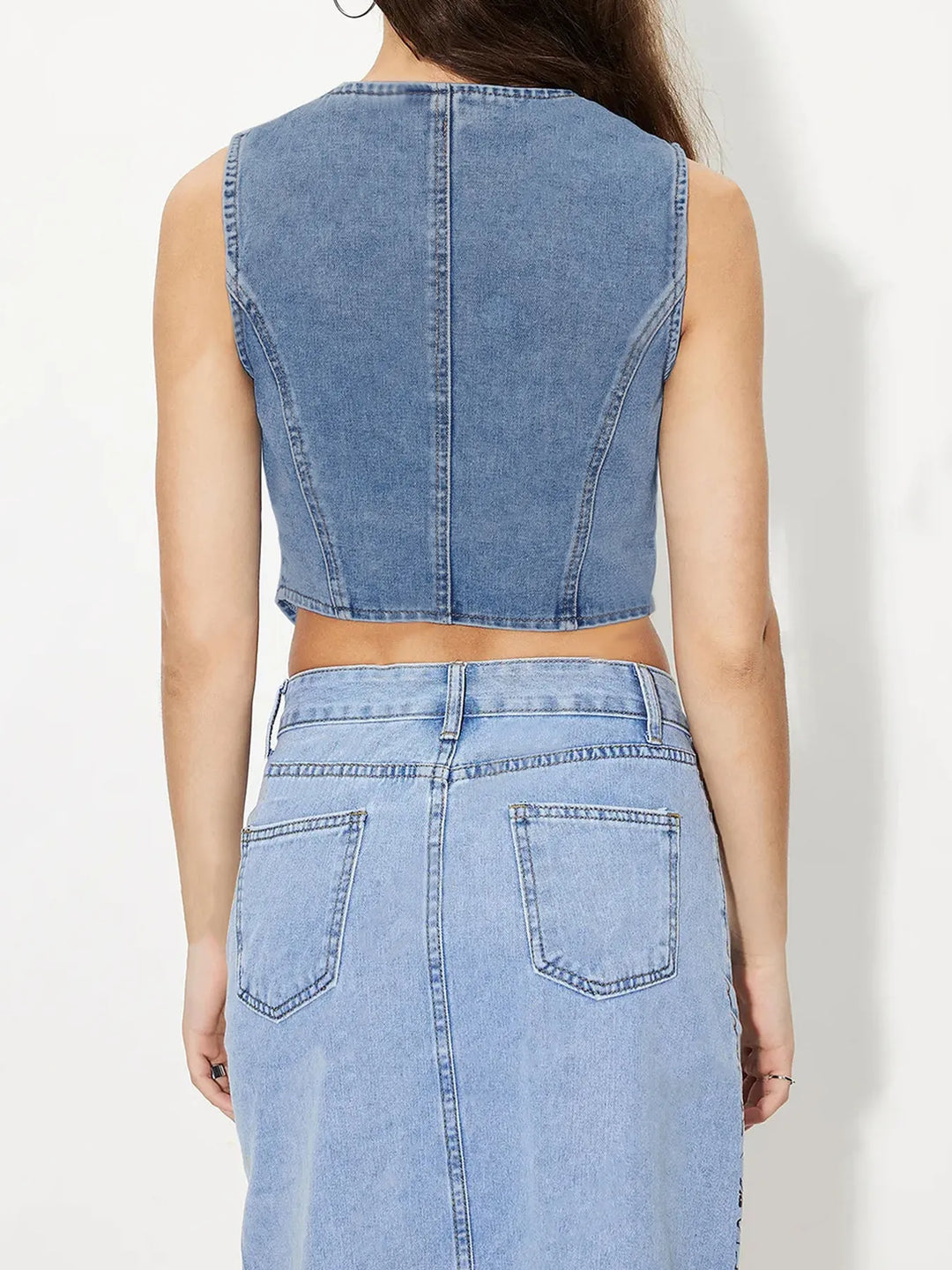 Fitted V-neck button-up denim vest with pointed hem