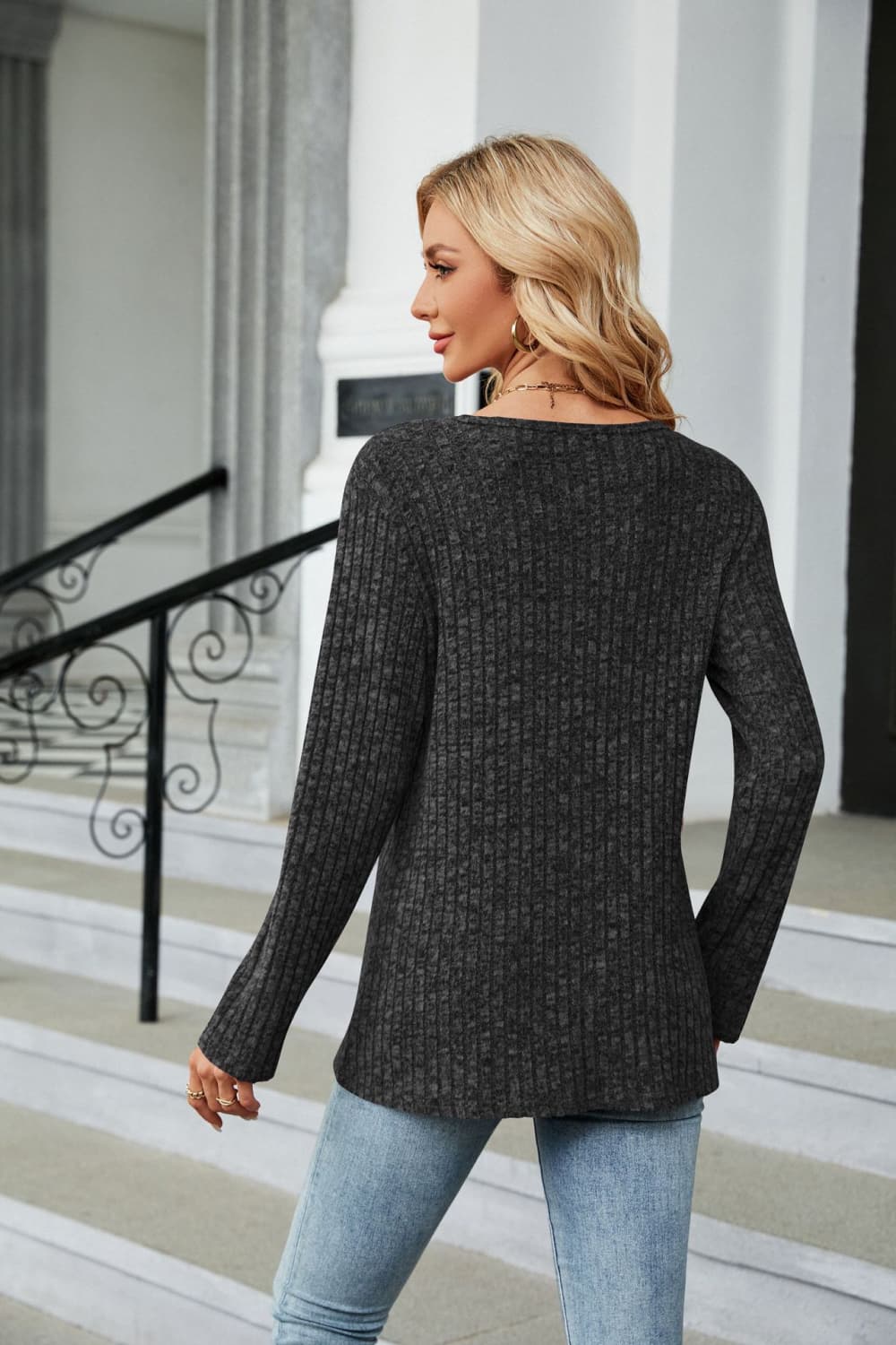 Ribbed knit long sleeve top with side buttons and slit hem