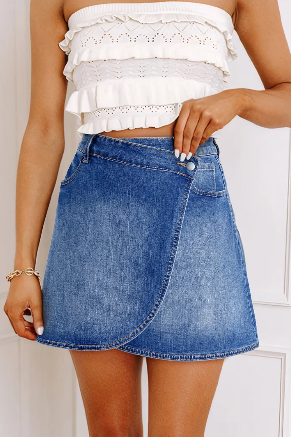 Medium Wrap-front denim mini skirt with angled hem seam