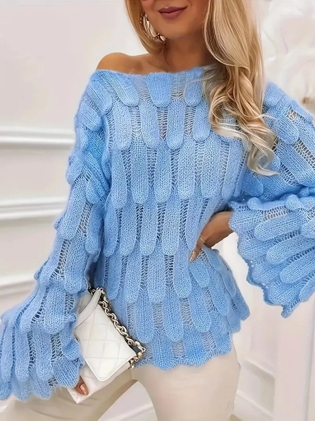 Openwork textured knit top with bell sleeves and scalloped hem