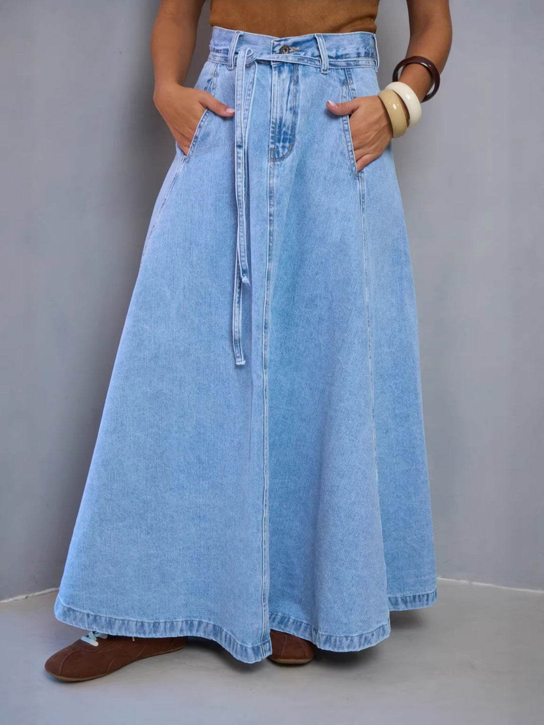 High-waisted belted A-line maxi denim skirt