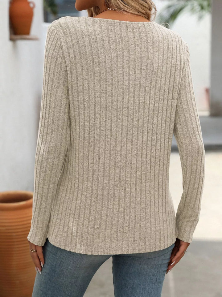 Ribbed knit long sleeve top with asymmetric button neckline