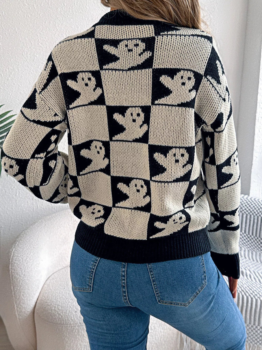 Checkered ghost print crew neck sweater with ribbed cuffs