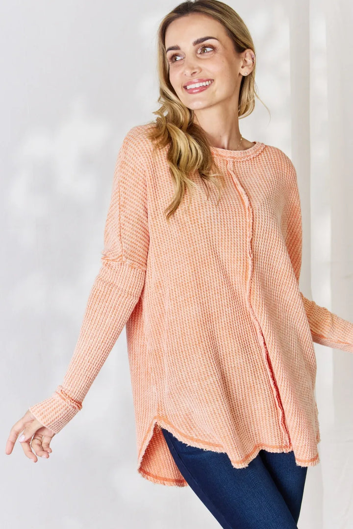Oversized waffle knit long sleeve top with exposed seams