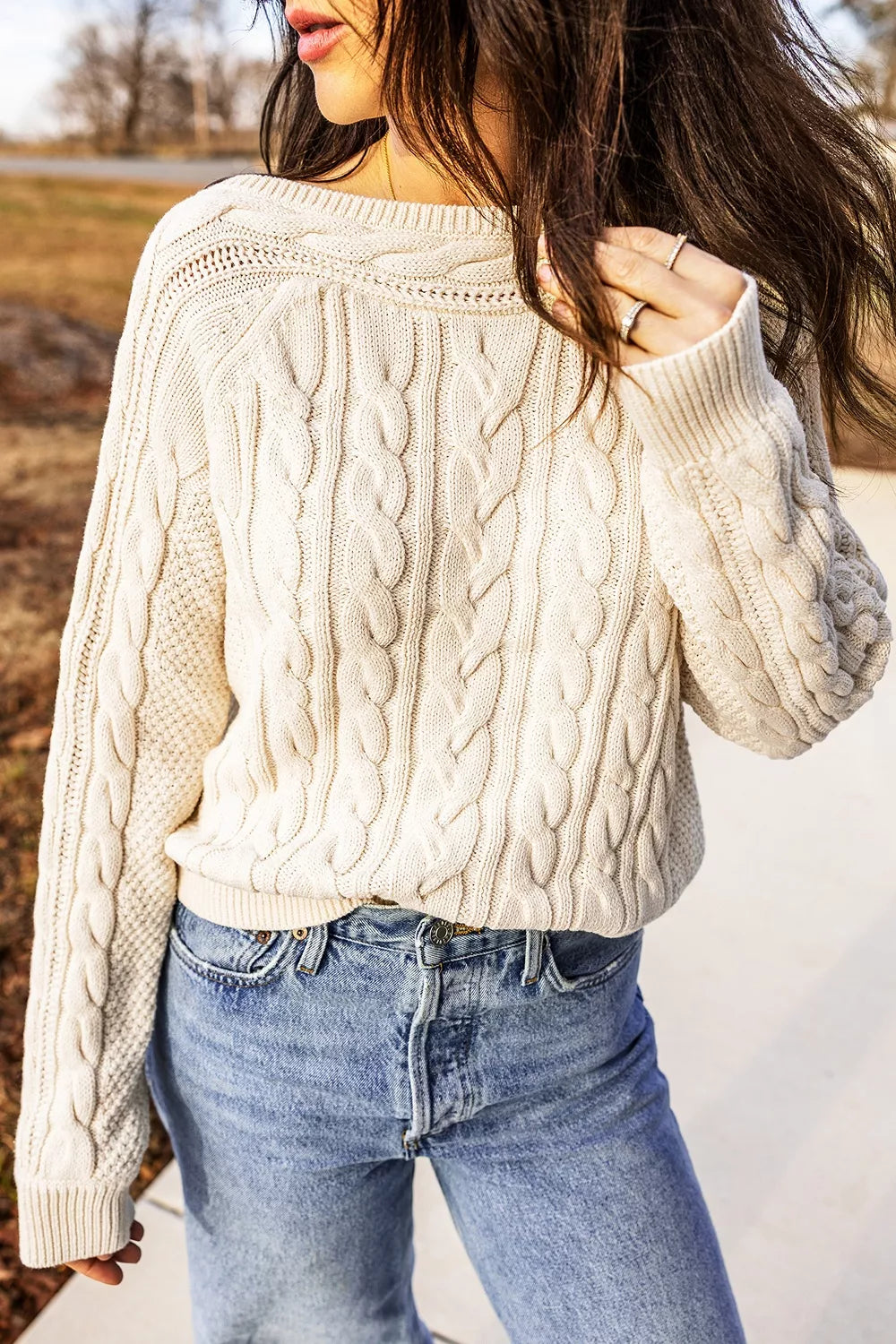 Cable knit drop shoulder sweater with ribbed cuffs