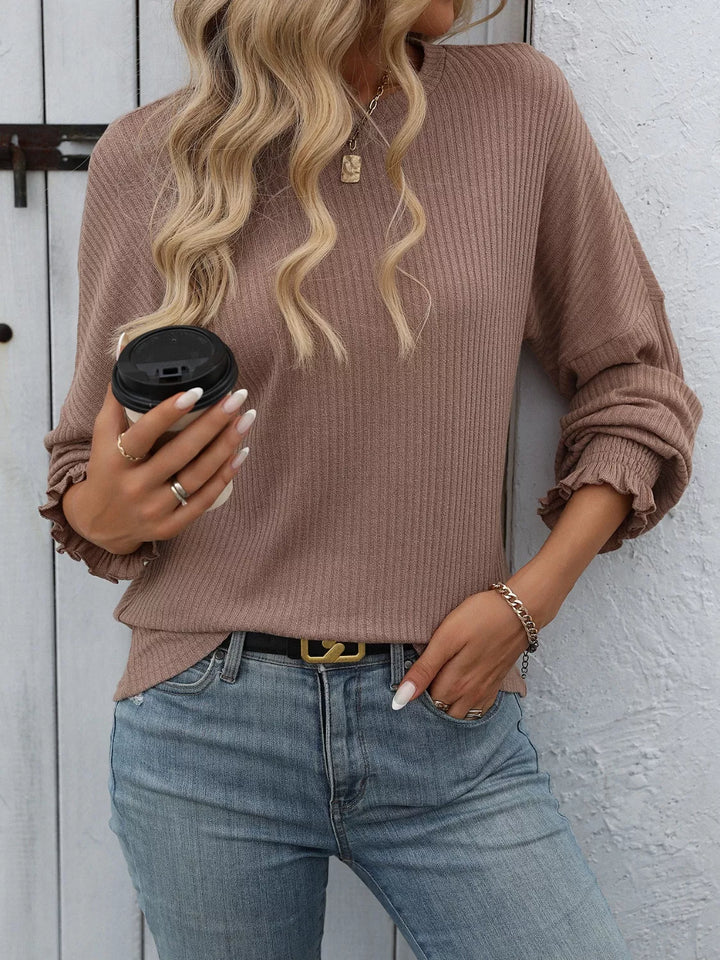 Ribbed knit crew neck top with ruffled smocked cuffs