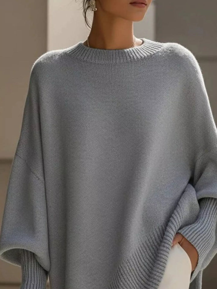 Batwing sleeve oversized sweater with asymmetric hem