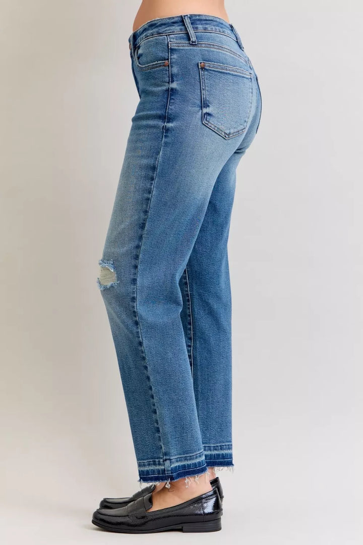 Distressed mid-rise boyfriend jeans with released raw hem