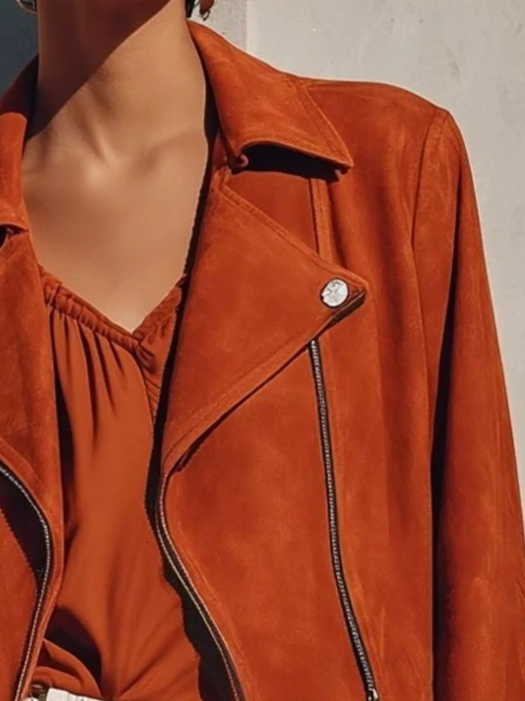 Fringe hem faux leather moto jacket with asymmetrical zip
