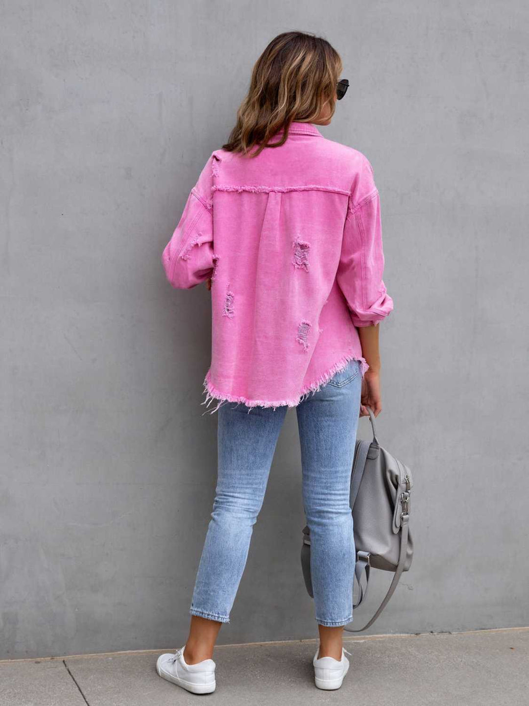 Distressed drop shoulder denim jacket with fringe hem